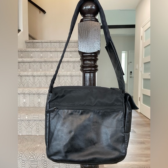 Prada Handbags - Prada. Black leather and nylon messenger bag. Very clean,no rips,no fading.